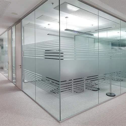 Glass-walled rooms along a corridor, the layout used for consultation rooms in a clinic